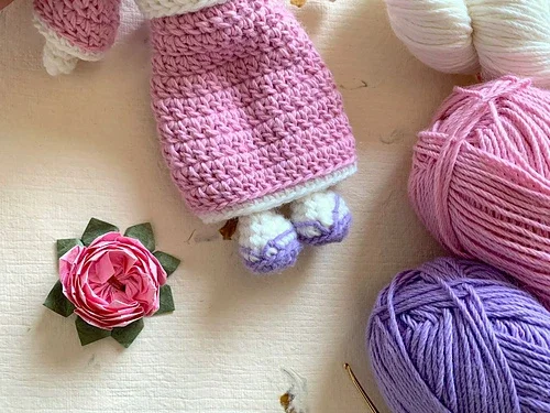 pink crochet outfit for amigurumi bunny pattern with purple and white yarn