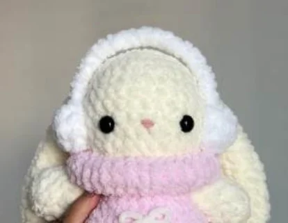 Original Baby Bunny wearing the sweater and earmuffs