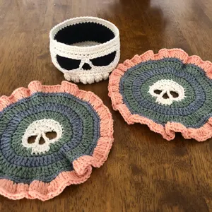 Customer-made skull crochet coaster set in peach, sage and grey