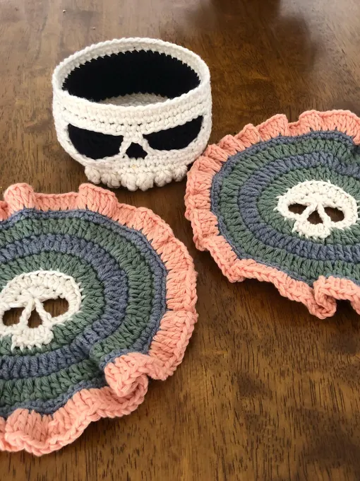 Customer-made skull crochet coaster set with sage, grey and peach yarn