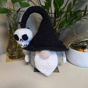 Black hat Halloween crochet gnome with skull and spider
