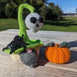 Green Halloween crochet gnome and orange crochet pumpkin variation